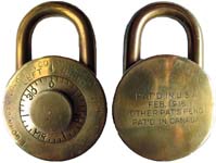 “E. GORNICEC” – Round. 2 7/8″ high x 1 13/16″ diameter. Brass body. Brass shackl