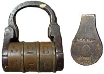 “E.M.R. PARIS DEPOSE”. Steel body. Steel shackle. Brass wheels.