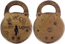 “M. W. CO. EIGHT LEVER”. 3 1/2″ x 2 1/2″. Stamped Steel body. Steel shackle. Bra