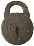 “O. & L. HDW. CO. EIGHT LEVER”. 2 1/2″ wide. Stamped Steel body. Steel shackle.