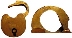 “A. E. DEITZ” – “220”. 1″ high. Brass body. Brass shackle. The reverse of the ca