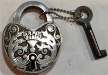 “D.R.PAT. 34634”. 2 5/8″ high x 2″ wide. Steel body. Steel shackle. Lever. Over