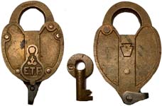 “E.T.F.”. 4″ high x 2 1/2″ wide. Brass body. Brass shackle. Brass dust guard.