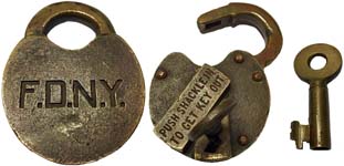 “F.D.N.Y.” – “PUSH SHACKLE IN TO GET KEY OUT”. 3 1/4″ high x 2 1/2″ wide x 5/8″.