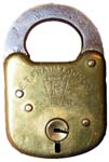 “E. T. FRAIM LOCK CO. 4 LEVERS” – Stamped Brass Case – Flat Steel Shackle – Flat