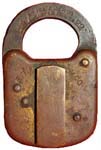 “E. T. FRAIM LOCK CO.”. 3″ high x 2″ wide. Stamped Brass body. Flat steel shackl