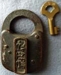 “G.T.R. SIGNAL”. 3″ high x 2″ wide. Brass body. Flat brass shackle. Post key. Ca