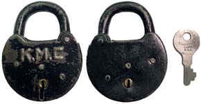“K. M. C”. Stamped Steel body. Steel shackle.