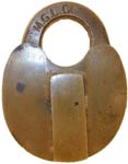 “M. G. L. Co.”. 2 3/4″ high x 2 1/8″ wide. Brass body. Brass shackle. “J. H. W.