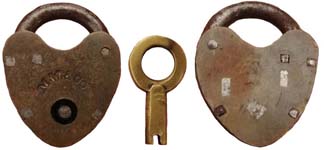 “M.W. & CO.”. 1″ high x 3/4″ wide. Brass body. Steel shackle.