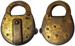 “N.Y. TEL. CO.”. 3 1/2″ high x 2 1/2″ wide. Stamped Brass body. Brass shackle.