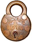 “O.M.E.CO. 3LEVER”. 3 1/8″ high x 2 3/8″ wide x 5/8″ deep. Brass body. Brass sha