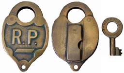 “R.P.”. 2 1/2″ wide. Brass body. Brass shackle.
