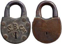 “S. B. Co.”. 2 7/8″ high x 2″ wide. Brass body. Brass shackle.