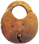 “C. SCHWEITZER NEW YORK 5”. 2 7/8″ high x 2 1/2″ wide x 9/16″ deep. Brass body.