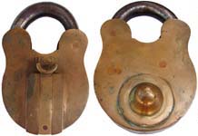 “C. SMITH & SONS NE 1”. 4 5/8″ high x 3 1/16″ wide. Brass body. Steel shackle. T