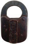 “T.T.R. SIGNAL”. 3″ high x 2″ wide. Stamped brass body. Flat brass shackle. Post