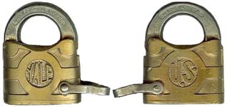 “U.S.” – “YALE”. 2″ high x 1 5/8″ wide. Brass body. Steel shackle. Yale standard