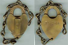 “U.S.” – “BTY. DYER.”. Brass body. Brass shackle. Lever.