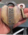 “U.S. CUSTOMS N.Y.C.S.Y.. Brass body. Steel shackle.