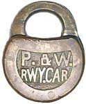 “P. & W. RWY.CAR” – No Pins. 2 3/4″ high x 2 1/4″ wide. Mfg: Slaymaker-Barry Co.