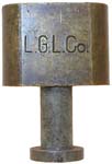 “L. G. L. Co.”. 1 1/4″ wide. Brass body. Steel shackle.
