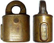 “A.A.F.”. 2 1/2″ high x 1 3/4″ wide. Stamped Brass body. Brass shackle. Pin tumb