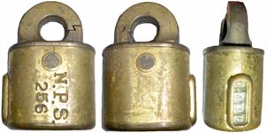 “N.P.S.”. 2 1/2″ high x 1 3/4″ wide x 1 1/8″ deep. Stamped Brass body. Brass sha