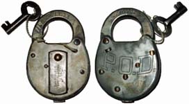 “P.O.D.”. Stamped Steel body. Steel shackle. Used on motor vehicles starting in