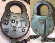 “P.O.D.”. Stamped Steel body. Steel shackle. Used on motor vehicles starting in