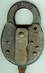 “P.O.D.”. Stamped Steel body. Steel shackle. Used on motor vehicles starting in