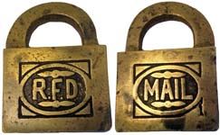 “R.F.D” – “MAIL”. 2 1/8″ high x 1 1/2″ wide. Brass body. Brass shackle. Warded.