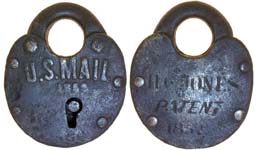 “U.S. MAIL 1859”. 2 1/4″ high x 1 9/16″ wide. Iron body. Iron shackle. “H. C. JO