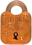 “U.S. REG’D. MAIL”. Brass body. Steel shackle. “EAGLE LOCK CO” is stamped on the