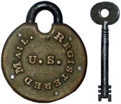 “U. S. REGISTERED MAIL”. 3″ high. Bronze body. Steel shackle. Warded.