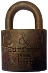 “C. & H.” – “Surface” – “XLCR TRADE MARK”. 2″ wide. Brass body. Brass shackle. (