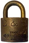 “C. & H.” – “XLCR TRADE MARK”. 2″ wide. Brass body. Brass shackle. (C)