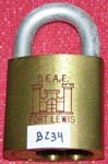 “D.F.A.E. FORT LEWIS” – “???”. Size: 4B72. Padlock Stamp #: 1391-E. Color: Red.