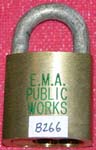 “E.M.A. PUBLIC WORKS”. Size: 4B72. Padlock Stamp #: 1533-E. Color: Green.
