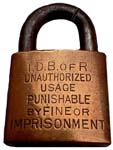 “I.D.B. OR R. UNAUTHORIZED…”. Brass body. Steel shackle.