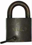 “M.L.&P.”. Brass body. Steel shackle.