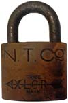 “N. T. CO” – “XLCR TRADE MARK”. 2″ wide. Brass body. Steel shackle. (C)