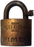 “P.I.M.CO” – “XLCR TRADE MARK”. 2″ wide. Brass body. Steel shackle. (R)