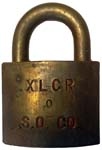 “S.O. CO.” – “0” – “XLCR”. 2″ wide. Brass body. Brass shackle. The “0” was not f