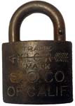 “S. O. CO.” – “OF CALIF.” – “XLCR TRADE MARK”. 2″ wide. Brass body. Brass shackl