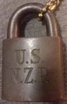 “U.S. N.Z.R.”. Brass body. Steel shackle.