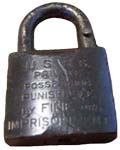 “U. S. R. S. PRIVATE…”. Brass body. Brass shackle. The reverse of the case is