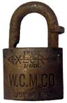 “W.C.M.CO” – “XLCR TRADE MARK” – “USE NO OIL”. 2″ wide. Brass body. Steel shackl