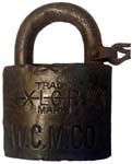 “W.C.M.CO” – “XLCR TRADE MARK”. 2″ wide. Brass body. Steel shackle. (R)