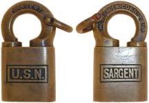 “U.S.N.”. Brass body. Brass shackle. Keyway: Paracentric. Clevis on shackle. “SA